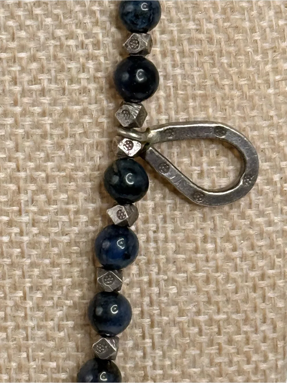 sterling silver necklace dark blue lapis lazuli beads geometric silver accents.